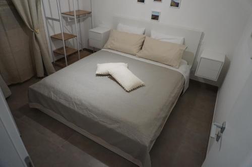 Tempat tidur dalam kamar di La Casina