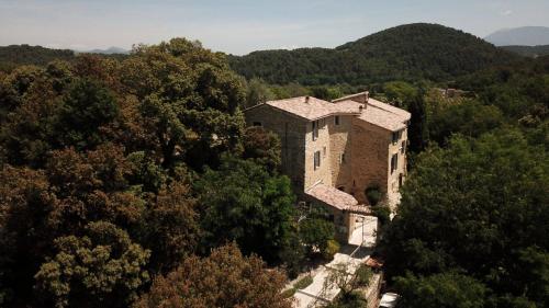 an aerial view of a building in the trees at Hôtel La Bastide de Vaison in Vaison-la-Romaine