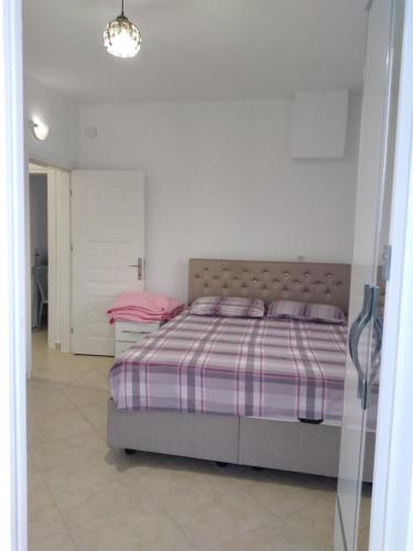 Postel nebo postele na pokoji v ubytování Uçar apart