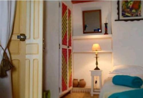 Una cama o camas en una habitación de Riad Dar Latifa