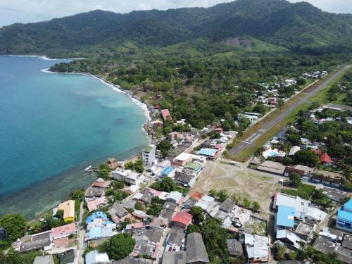 an aerial view of a town next to the ocean at Casa Galú - Capurganá in Capurganá