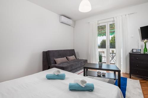 Postel nebo postele na pokoji v ubytování Apartment La Perla