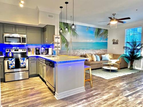 an open kitchen and living room with a couch at Island Breeze - 1BR/ Medical Center/ NRG/Galleria/Downtown in Houston