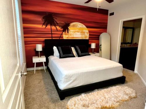 a bedroom with a large bed with a wooden wall at Island Breeze - 1BR/ Medical Center/ NRG/Galleria/Downtown in Houston