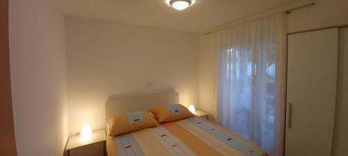 Una cama o camas en una habitación de Apartment Onbria Mar