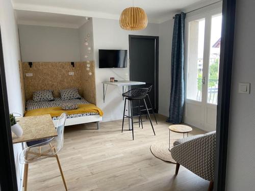 Posteľ alebo postele v izbe v ubytovaní L'Eldorado Ruthénois - Garage & Terrasse