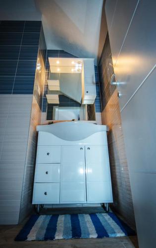 a bathroom with a white cabinet and a sink at Villa Mira Makarska - Imotski in Imotski