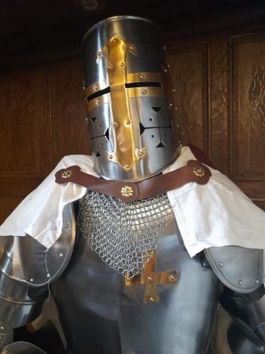 a metal armour on display in a museum at Stone Court House in Maidstone