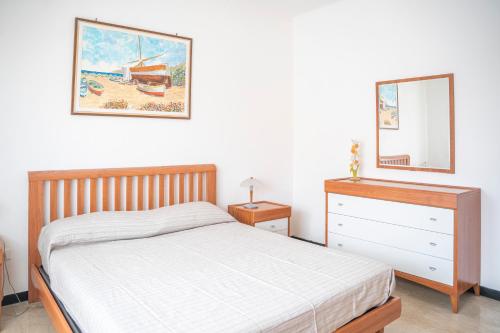 A bed or beds in a room at Appartamento Corsaro