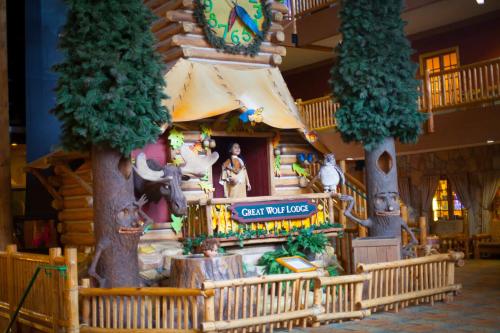 a gingerbread house in the lobby of a disney resort at Great Wolf Lodge Williamsburg in Williamsburg