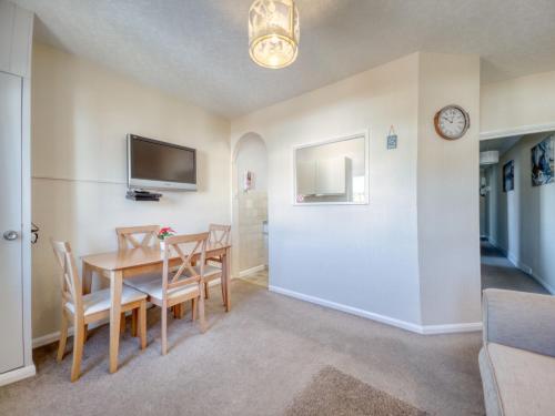 a kitchen and dining room with a table and chairs at Apartment 3 - 2 Bedroom town views in Paignton