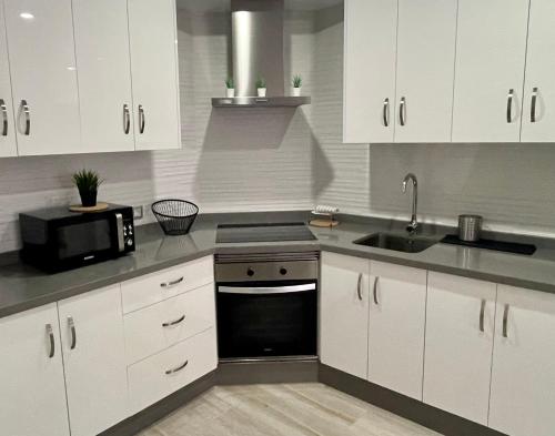 A kitchen or kitchenette at ISLAND SUITES