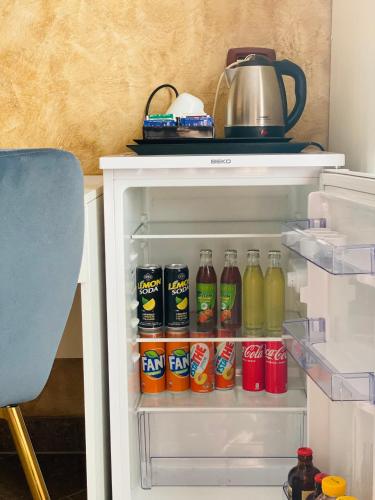 an open refrigerator filled with lots of drinks at Armonia B&B in Aquino