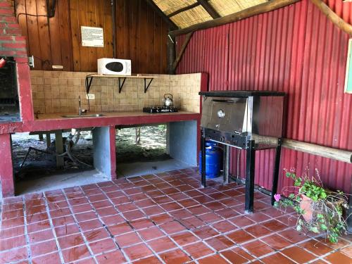 a kitchen with a sink and a stove in a building at Rio Manso Tigre in Tigre