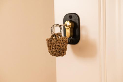 a keychain hanging from a door handle at Masseria Il Passo in Favignana
