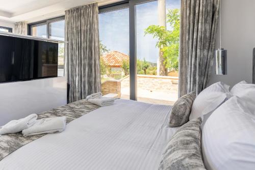 Postel nebo postele na pokoji v ubytování Vidikovac Levanda Luxury Apartments