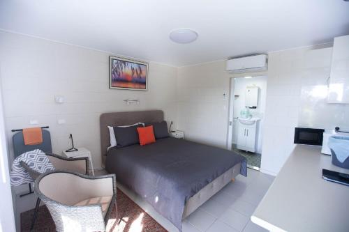 Ένα ή περισσότερα κρεβάτια σε δωμάτιο στο Tuross Head Motel