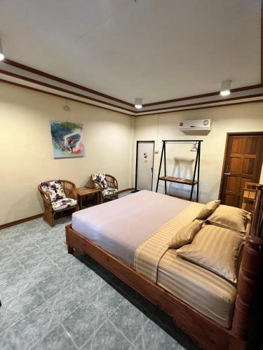 Ένα ή περισσότερα κρεβάτια σε δωμάτιο στο Sandee Bungalow