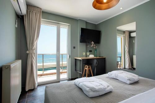 Posteľ alebo postele v izbe v ubytovaní CONTE CRISTO Suites