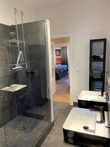 a bathroom with a shower and a sink at Apartment Factory in Hamburg