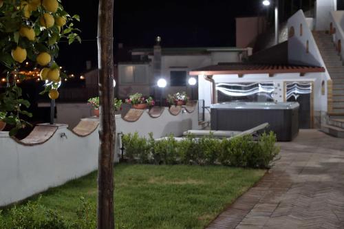 a backyard at night with a gazebo at Amalfi Sky View in Scala