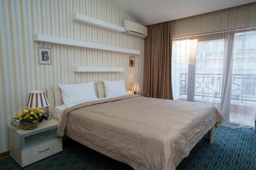 מיטה או מיטות בחדר ב-Austin Hotel Baku