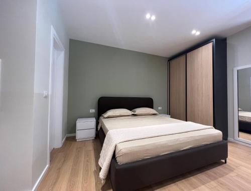 a bedroom with a large bed in a room at Costa Adriatica Apartments in Durrës