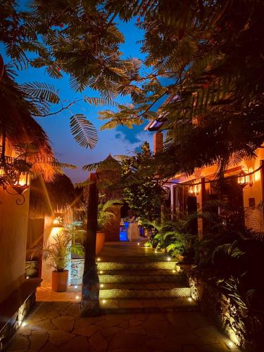 a night view of a courtyard with lights at Casa Miura Hotel Boutique in Ajijic