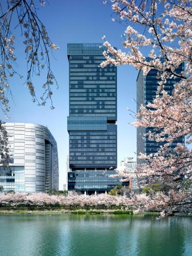 a view of a city withakura trees in the foreground at Sofitel Ambassador Seoul Hotel & Serviced Residences in Seoul