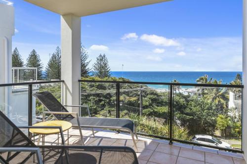 a balcony with chairs and a view of the ocean at 2 Ballin Wonderous White Waters in Sunshine Beach