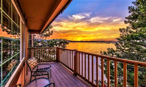 a balcony with chairs and a view of the water at The Tahoe Beach & Ski Club Owners Association in South Lake Tahoe
