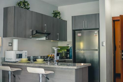 Кухня или мини-кухня в ARMONIA 408 APARTMENT IN GAZCUE
