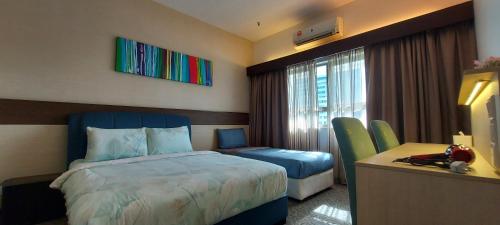 A bed or beds in a room at KLCC PlayStation (8pax) 17