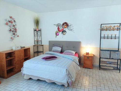 a bedroom with a bed and a mirror in it at Holiday home near the sea, Audierne in Audierne