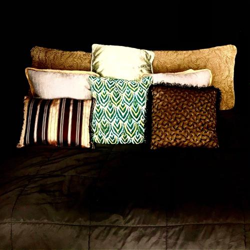 a pile of pillows sitting on top of a couch at Beachfront Paradise in Manuel Antonio