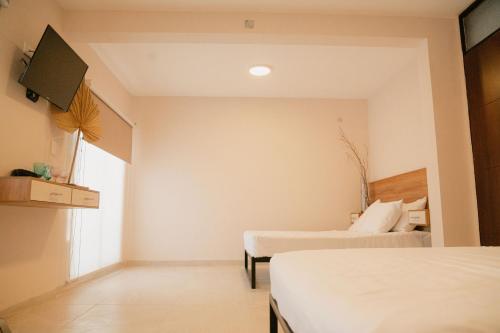 Llit o llits en una habitació de Hotel Fratelli