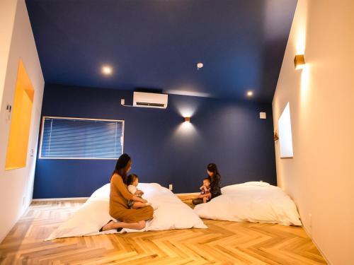Postel nebo postele na pokoji v ubytování LifeStyleHotel ichi一棟貸切りホテル