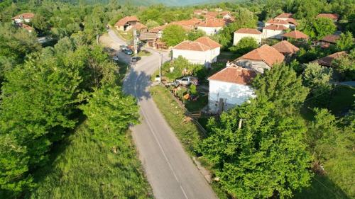 an aerial view of a village with a road and houses at VILA BOJANA in Inovo