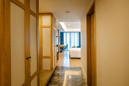 a hallway with a door leading to a room at FLC City Hotel Beach Quy Nhon in Quy Nhon