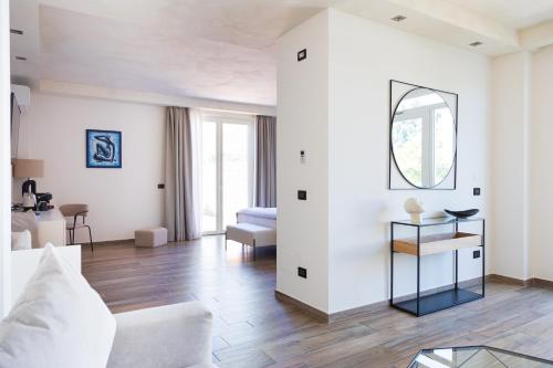 a living room with a couch and a table at Casabianca Resort in Fondi