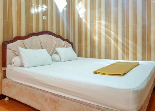 Postel nebo postele na pokoji v ubytování Hotel Mario Pulana Bone