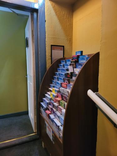a hallway with a bunch of cards on a wall at The Residence - NO 8 in Edinburgh