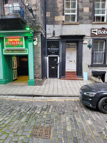 a car parked on a street in front of a building at The Residence - NO 8 in Edinburgh