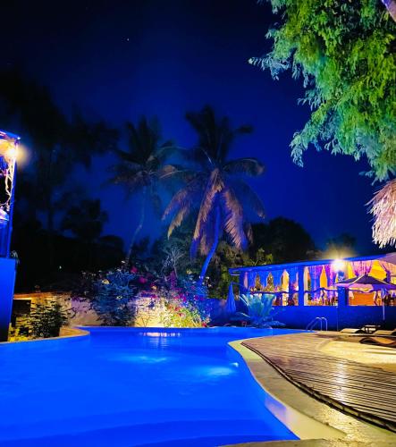 a swimming pool at night with blue lights at Ifaty Beach Club Resort in Ifaty