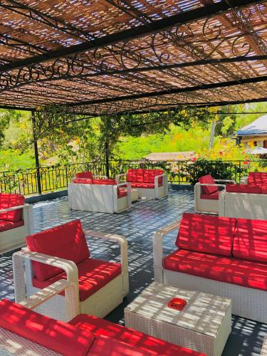 a group of couches and chairs under a pergola at Ifaty Beach Club Resort in Ifaty