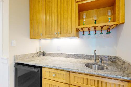 a kitchen counter with a sink and a dishwasher at Sunset Island - Beachside Mews 1 & 2 in Ocean City