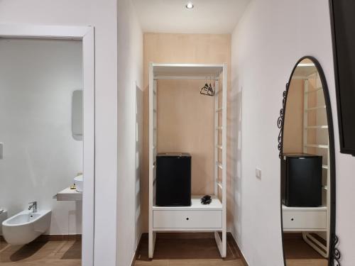 a bathroom with a sink and a mirror at Agriturismo Sa Jana Holidays - Adults Only in Cardedu