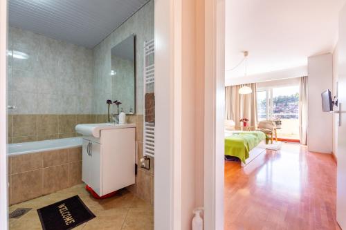 Kylpyhuone majoituspaikassa Dimar Apartments