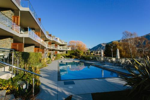 arial view of a hotel with a swimming pool at Lakeside Apartments in Wanaka