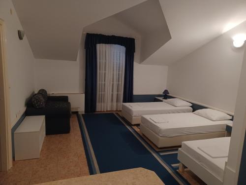 Postel nebo postele na pokoji v ubytování Hotel Ivan Dujmović Dvori